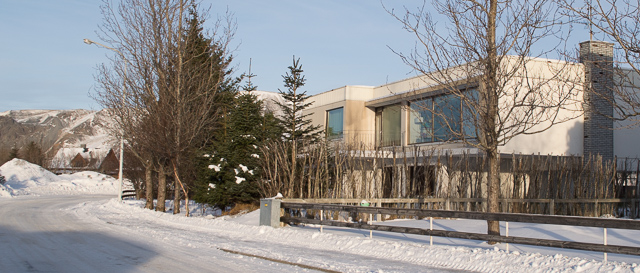 Thoristun Villa.  Street view in winter.  With a view towards the mountains.  